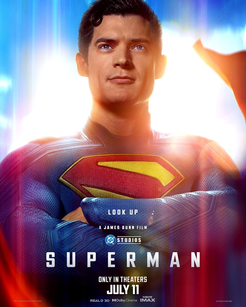 Image Description: The background is a sunny sky. The foreground is Superman, with his arms crossed, a content look on his face with his cape flapping behind him. Written in white: "LOOK UP" "A JAMES GUNN FILM" "DC STUDIOS" "SUPERMAN" "ONLY IN THEATERS JULY 11TH" "REAL 3D DOLBY CINEMA FILMED FOR IMAX" End of Image Description.